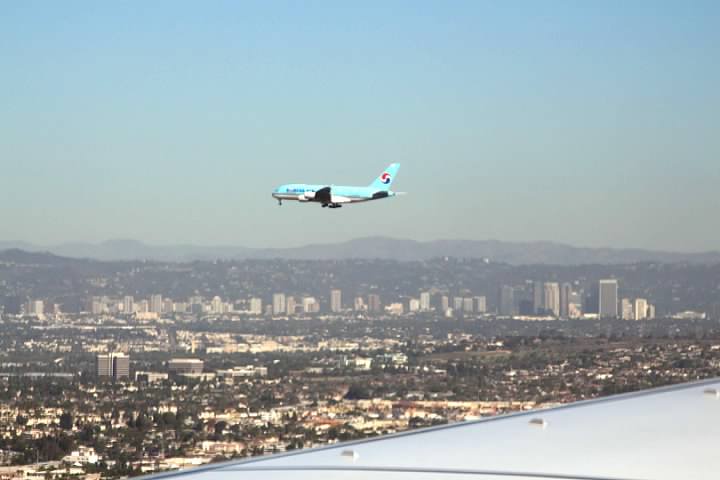 A Korean Air plane approaching LAX to land on a parallel runway to ours